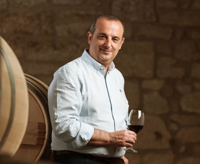 Julio Saenz with a glass of Rioja in hand
