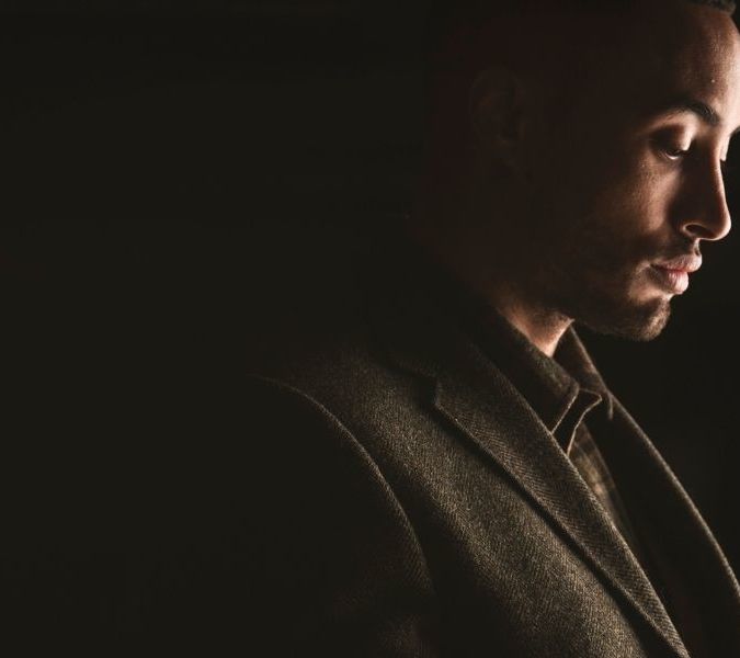 Man holding glass of Bowmore whisky