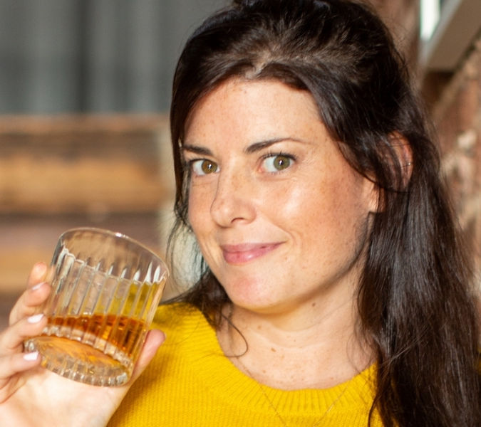 Becky Paskin drinking a glass of whisky