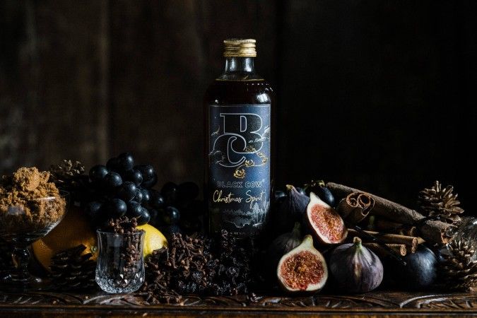 black cow christmas vodka bottle with figs and spices
