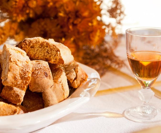 vin santo sweet wine with biscotti on table