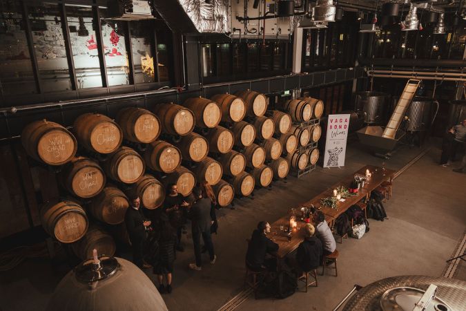table and barrels inside vagabond urban winery