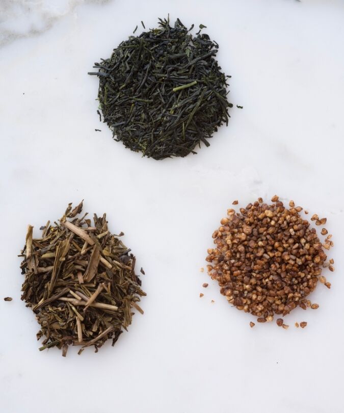 A selection of three artisanal teas on a marble surface