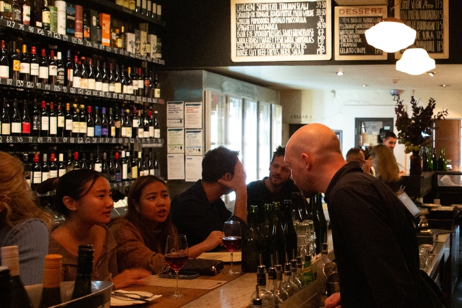 Revelers inside the Melbourne wine bar, City Wine Shop.