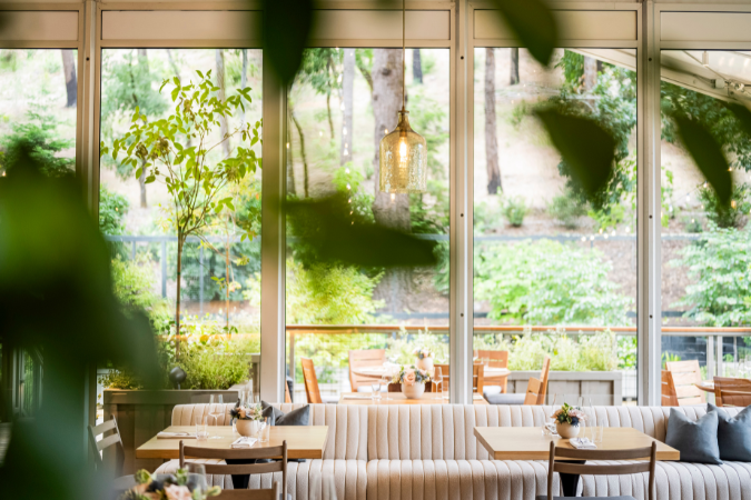 A view of the light and airy Forum Restaurant at the Meadowood Hotel in Napa