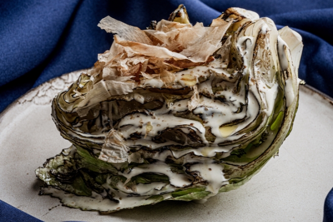 A large charred lettuce with Taramas dressing at Greek restaurant Kima