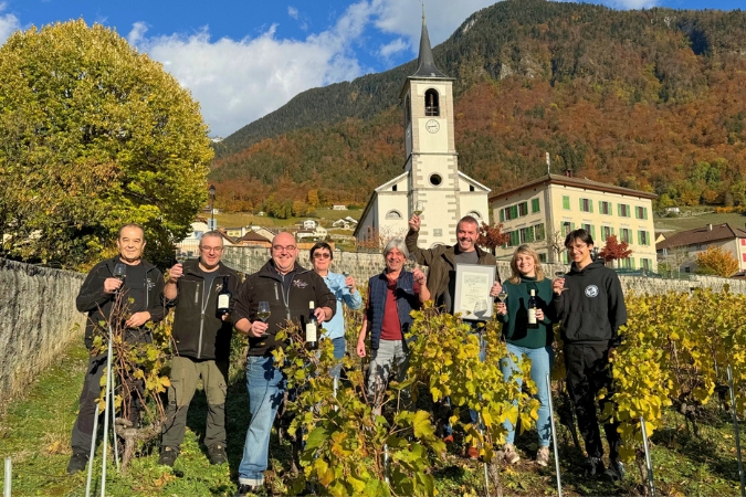 The Artisans Vignerons d'Yvorne team stood amongst the vines