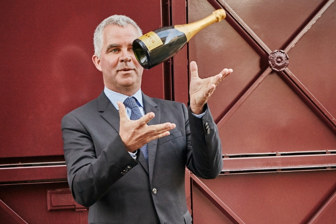 Olivier Krug throwing a bottle of Krug Grand Cuvée