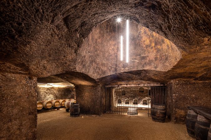 Bottles ageing in the tuffeau cellars located 7m underground at Clos Rougeard
