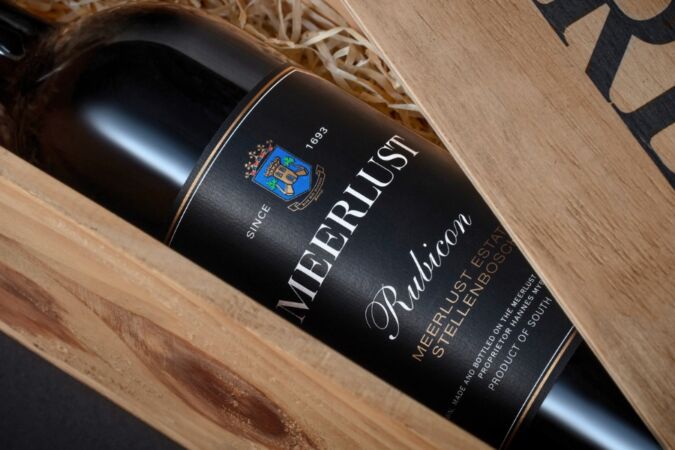 A bottle of Meerlust Rubicon in a wooden presentation box
