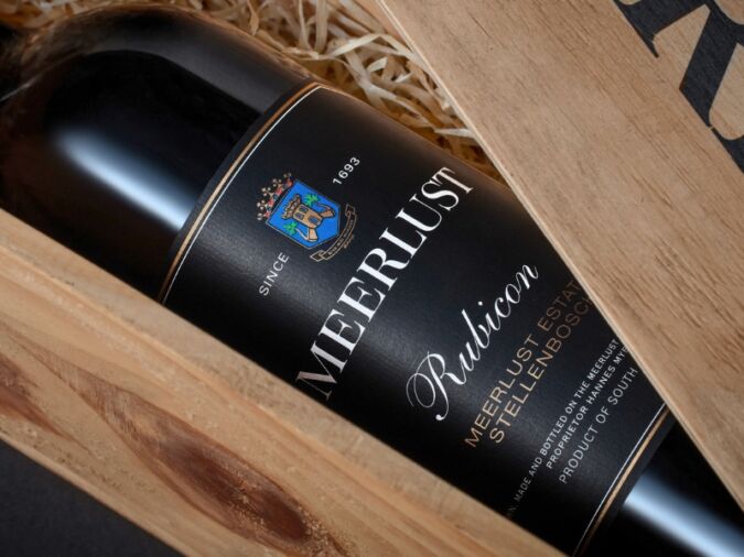 A bottle of Meerlust Rubicon in a wooden presentation box