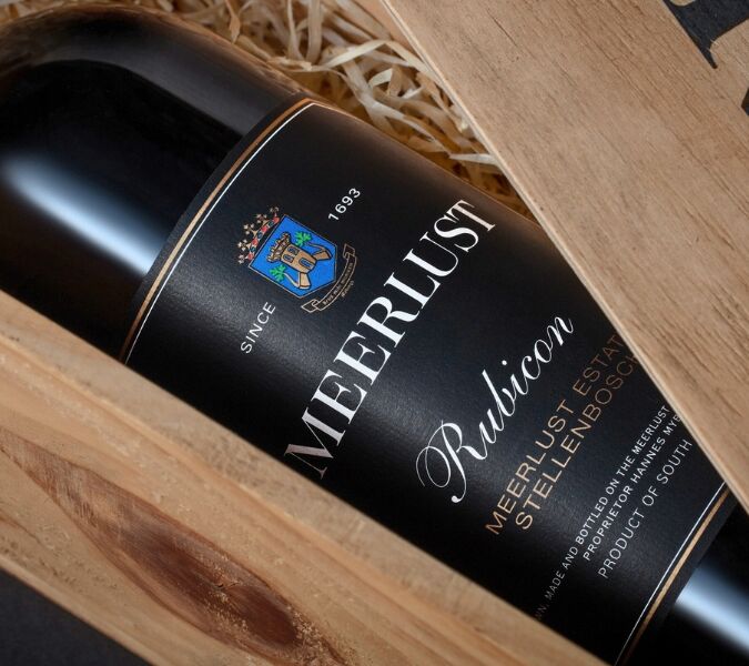 A bottle of Meerlust Rubicon in a wooden presentation box