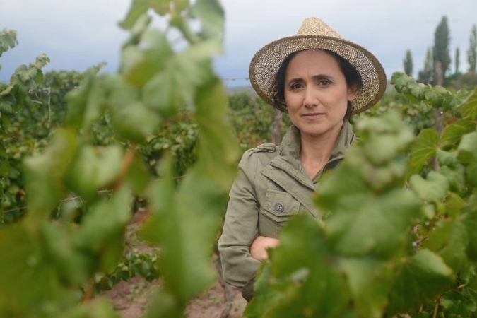 Laura Catena standing in a vineyardd