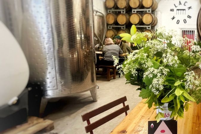 Tables and tank inside Blackbook winery