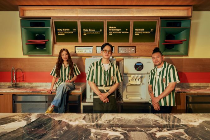 three unnecessary bartenders behind bar