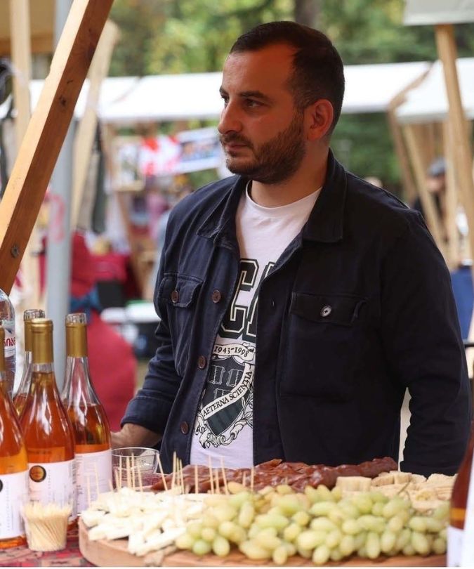 Winemaker Oto Bibileishvili with wine and local Georgian food
