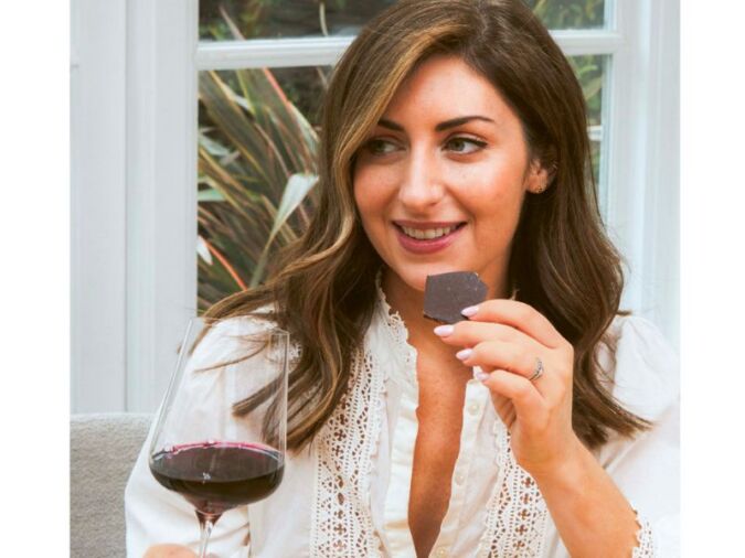 wine author charlotte kristensen holding chocolate and wine