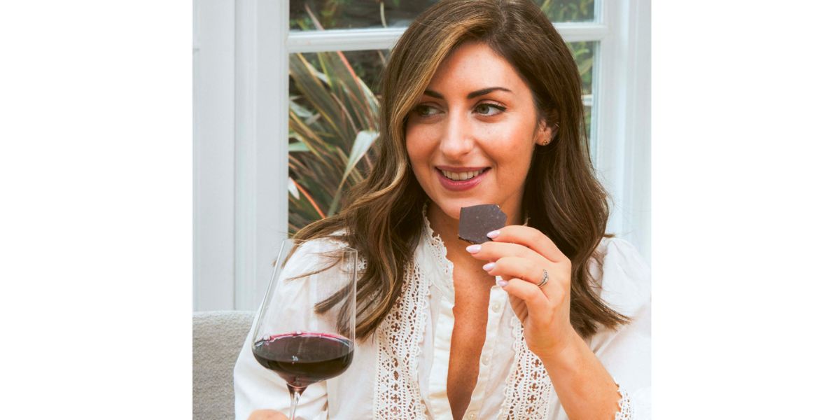 wine author charlotte kristensen holding chocolate and wine