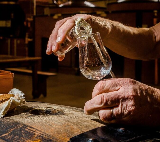 Liquid from barrel to glass at Cognac Frapin distillery