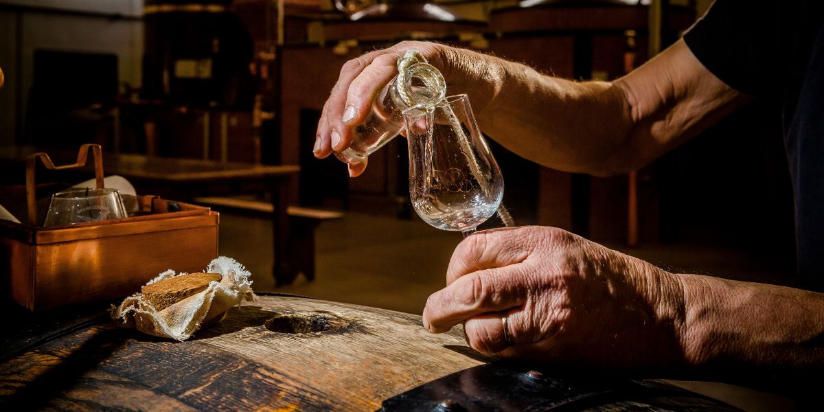 Liquid from barrel to glass at Cognac Frapin distillery