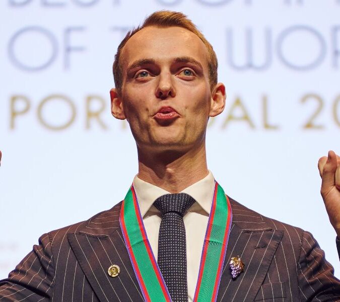 nikolai haram svorte on stage celebrating winning ASI best sommelier of the world